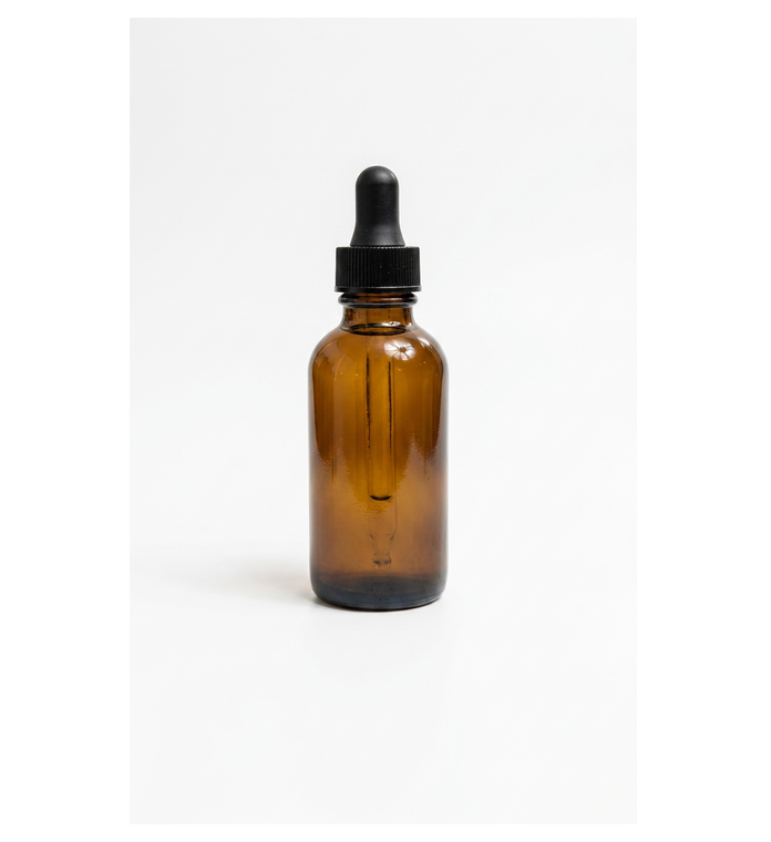 Amber dropper bottle photographed on a plain white background