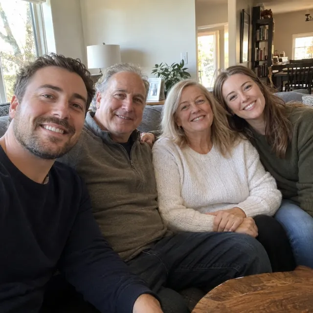 Synthetic source photo: four fictional adults sitting on a grey sofa in a living room
