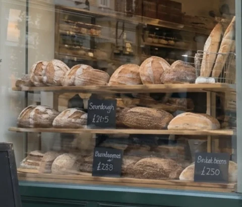 Close-up of the window price tags after Nano Banana 2.1 with invented bread names and prices