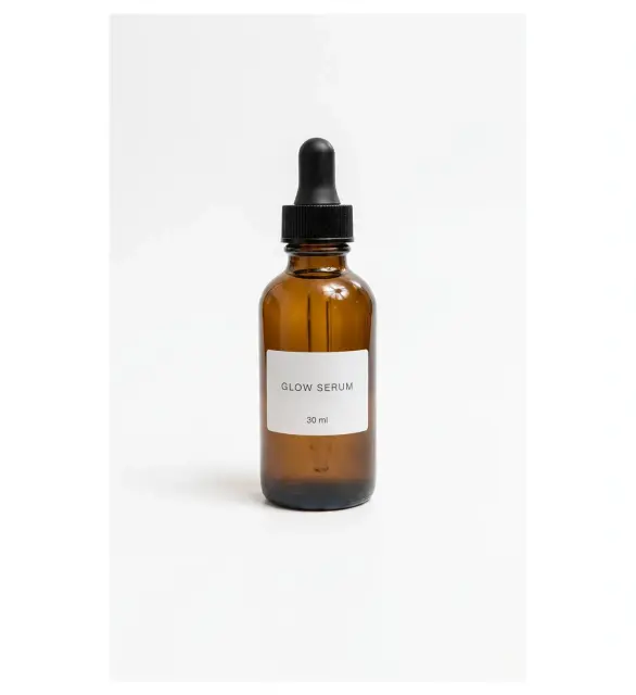 Add text: a label that reads GLOW SERUM, edited by Muse Image: Smallest label, both lines of text present.