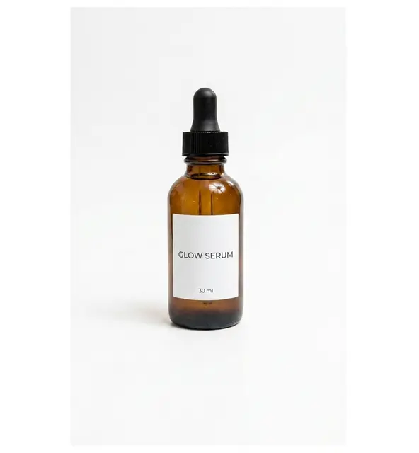 Add text: a label that reads GLOW SERUM, edited by Nano Banana Pro: Tall label, both lines of text present.