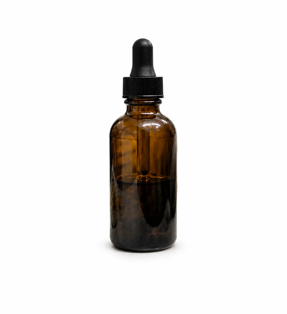 Amber bottle isolated against a light studio background